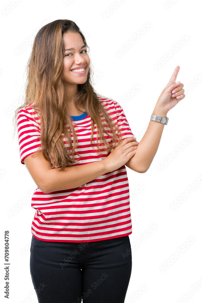 Young beautiful brunette woman wearing stripes t-shirt over isolated background with a big smile on face, pointing with hand and finger to the side looking at the camera. Young beautiful brunette woman wearing stripes t-shirt over isolated background with a big smile on face, pointing with hand and finger to the side looking at the camera.