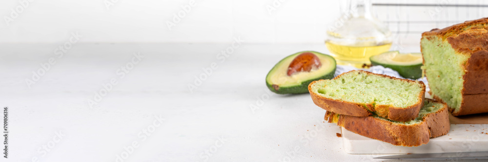 Homemade avocado loaf of bread, keto diet recipe, healthy alternative food idea, on white kitchen background with fresh avocado, copy space Homemade avocado loaf of bread, keto diet recipe, healthy alternative food idea, on white kitchen background with fresh avocado, copy space