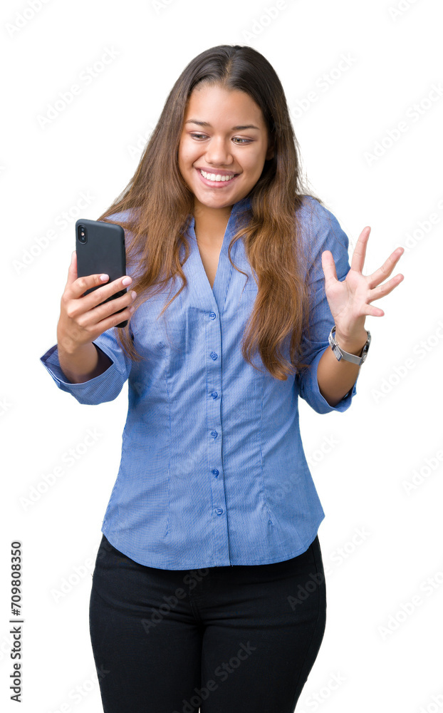 Young beautiful brunette business woman using smartphone over isolated background very happy and excited, winner expression celebrating victory screaming with big smile and raised hands Young beautiful brunette business woman using smartphone over isolated background very happy and excited, winner expression celebrating victory screaming with big smile and raised hands