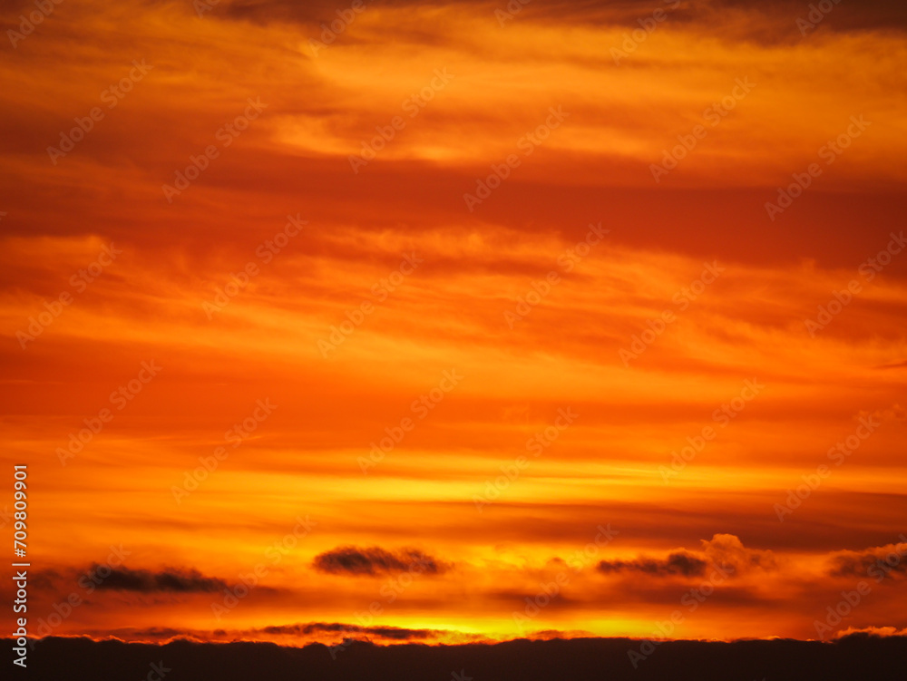orange yellow fiery sky with clouds