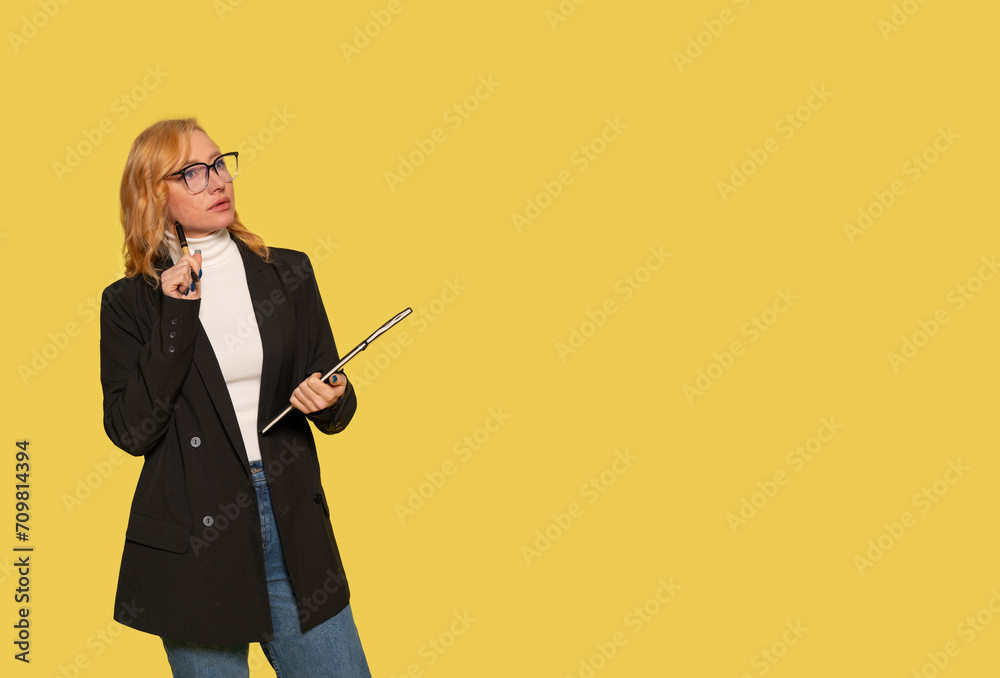 serious business woman manager in glasess with documents on a blue background working in a financial company success serious business woman manager in glasess with documents on a blue background working in a financial company success