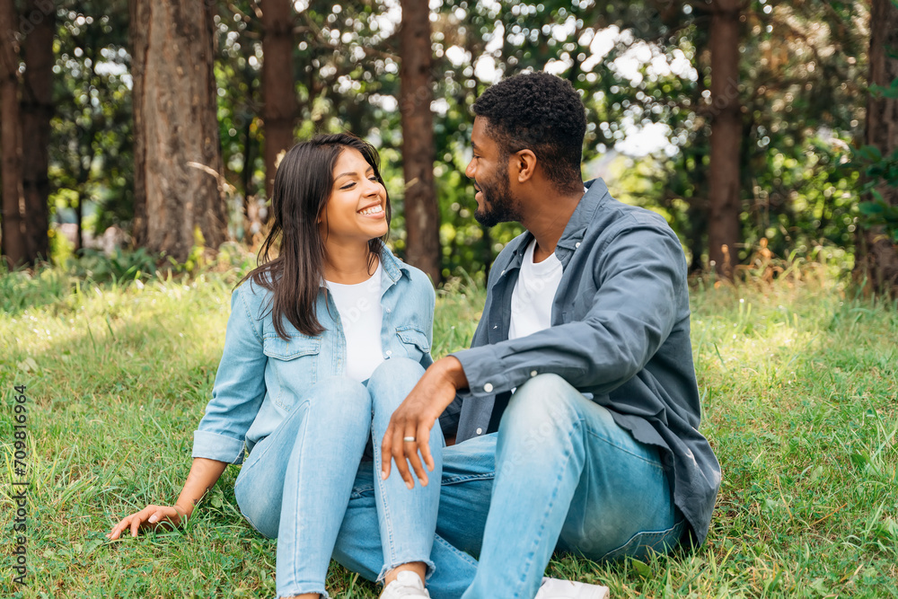 A handsome man and beautiful woman hugging each other and spending time in the park Time together A handsome man and beautiful woman hugging each other and spending time in the park Time together