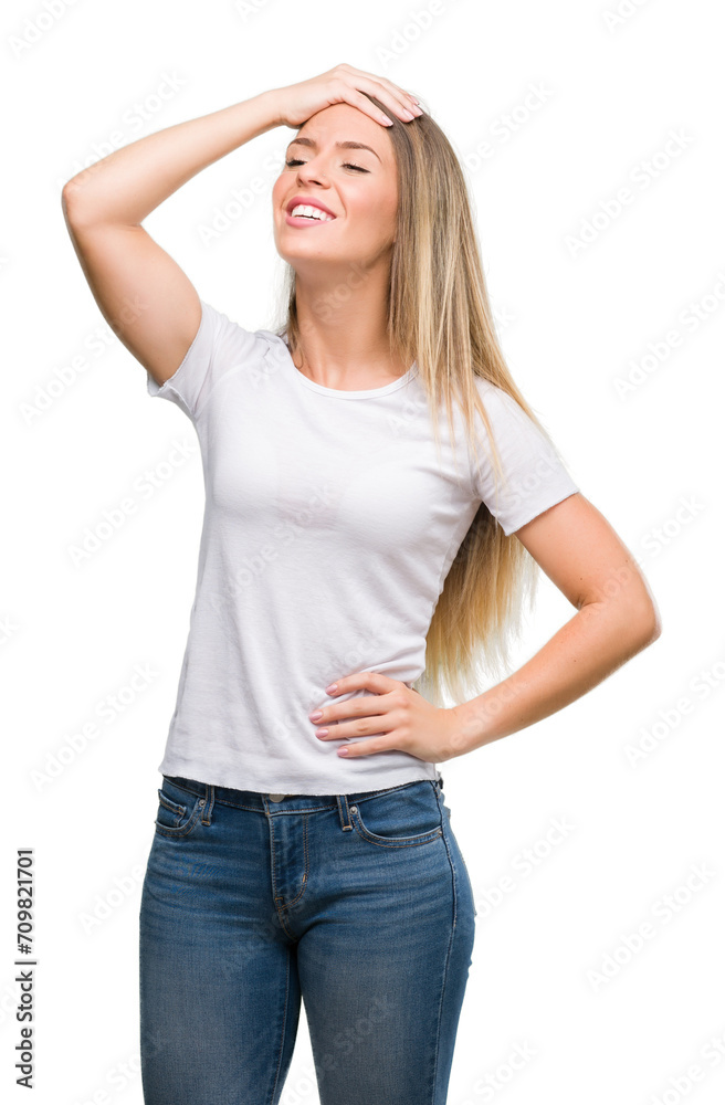 Obraz premium Beautiful young woman wearing t-shirt and jeans stressed with hand on head, shocked with shame and surprise face, angry and frustrated. Fear and upset for mistake.