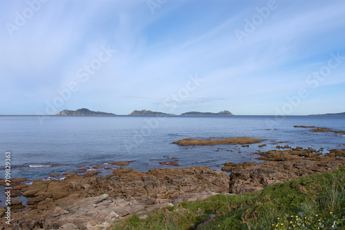 Walking through Cabo Estay you can see the small archipelago that protects the Ría de Vigo called Cies Islands where the beach is considered the best in the world. photo