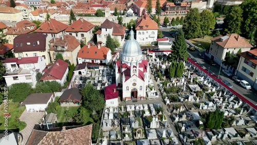 Drone footage of the Orthodox Church of St. Paraskeva and Schei Cemetery in Brasov, Romania photo