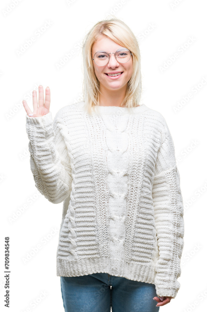 Young beautiful blonde woman wearing winter sweater and glasses over isolated background showing and pointing up with fingers number four while smiling confident and happy.