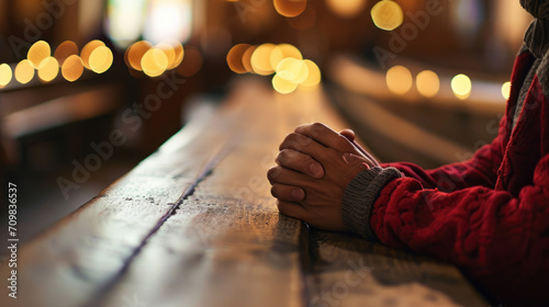 Elderly person's hands clasped together in a gesture of prayer photo