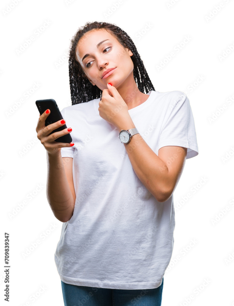 Young braided hair african american girl showing using smartphone over isolated background serious face thinking about question, very confused idea Young braided hair african american girl showing using smartphone over isolated background serious face thinking about question, very confused idea