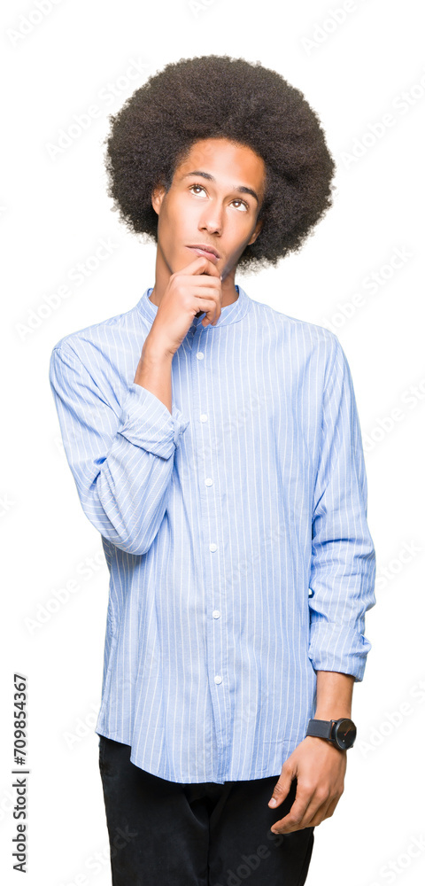 Young african american man with afro hair with hand on chin thinking about question, pensive expression. Smiling with thoughtful face. Doubt concept. Young african american man with afro hair with hand on chin thinking about question, pensive expression. Smiling with thoughtful face. Doubt concept.