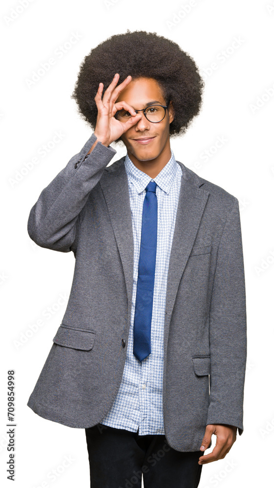 Young african american business man with afro hair wearing glasses doing ok gesture with hand smiling, eye looking through fingers with happy face. Young african american business man with afro hair wearing glasses doing ok gesture with hand smiling, eye looking through fingers with happy face.