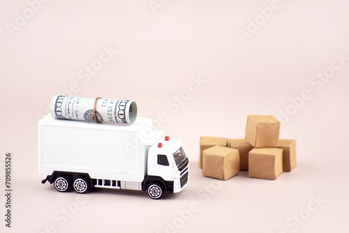White toy truck with boxes on a light background, space for text.