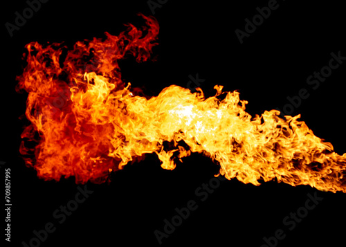 Breathing fire stream, flame isolated on black