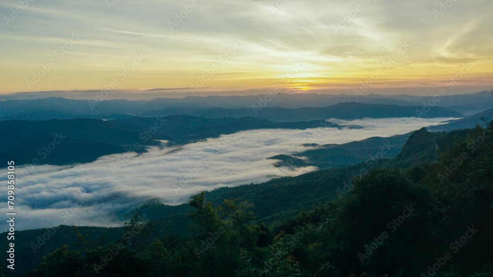 Morning fog at doi samer dao at Sri Nan national park, Thailand. Beautiful landscape Sea fog or sea of cloud view in the morning. Sunbeam in the mountains and mist.