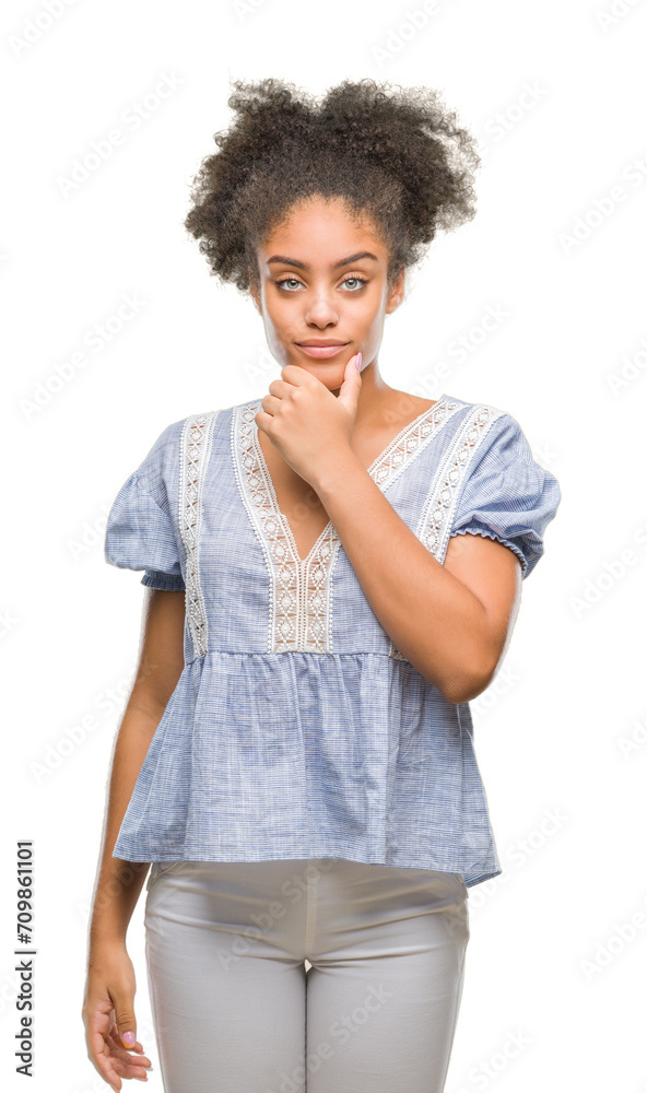 Young afro american woman over isolated background looking confident at the camera with smile with crossed arms and hand raised on chin. Thinking positive.