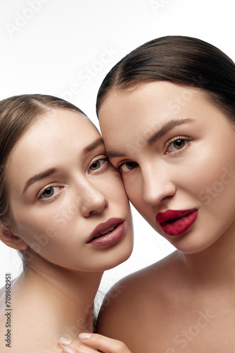 Fashion portrait of two girls with natural makeup. Emphasizing holistic approach to health and well-being through clear skin and natural beauty. Concept of youth, skin care, wellness, spa. Ad