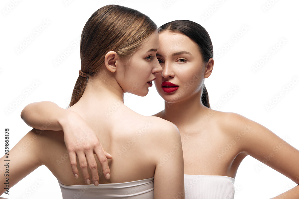 Health and wellness. Young pretty ladies with different types of skin standing near each other and posing against white background. Concept of female health, self care, natural cosmetic products. Ad Health and wellness. Young pretty ladies with different types of skin standing near each other and posing against white background. Concept of female health, self care, natural cosmetic products. Ad