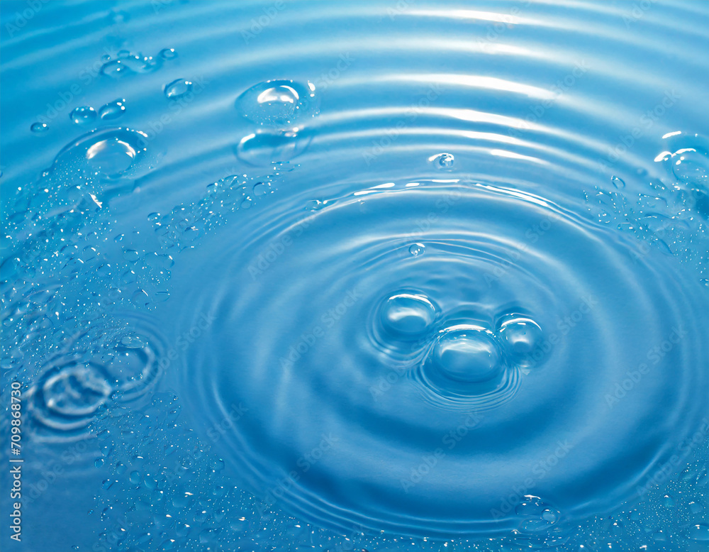 abstract fresh transparent blue water surface from above with rain drop circles in sunlight, liquid texture background concept for cosmetic moisturizer and beauty products with space for text abstract fresh transparent blue water surface from above with rain drop circles in sunlight, liquid texture background concept for cosmetic moisturizer and beauty products with space for text
