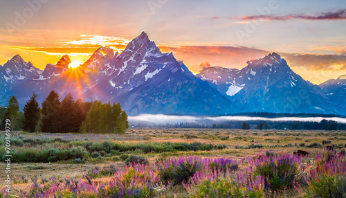 An epic sunrise at the grand teton national park in summer; image has copy space photo