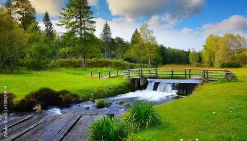 beautiful meadow with a river, a waterfall, a small bridge