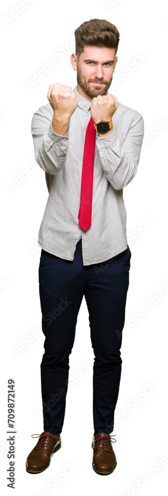 Obraz premium Young handsome business man Ready to fight with fist defense gesture, angry and upset face, afraid of problem