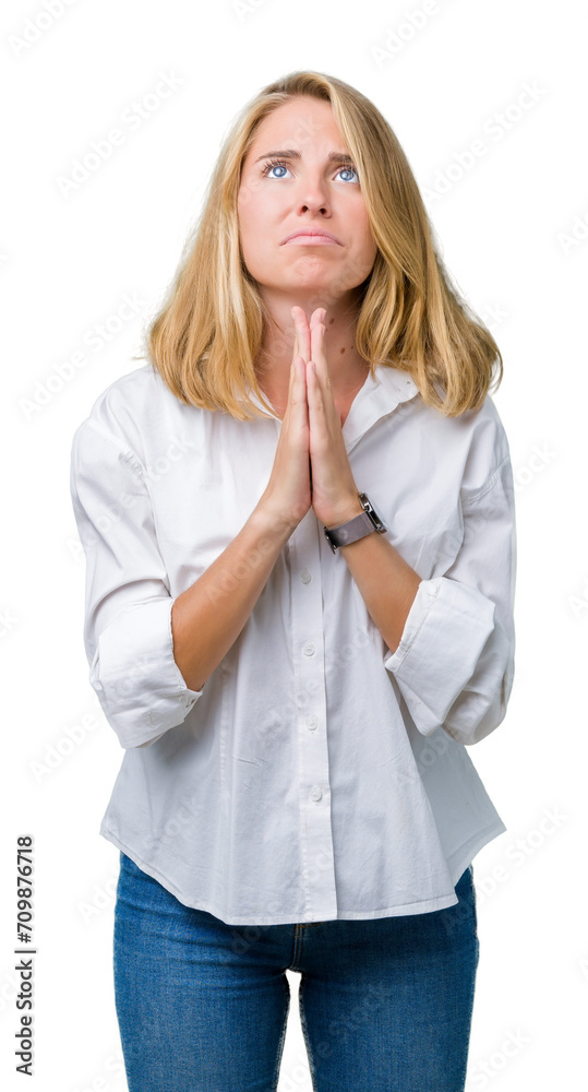 Beautiful young business woman over isolated background begging and praying with hands together with hope expression on face very emotional and worried. Asking for forgiveness. Religion concept. Beautiful young business woman over isolated background begging and praying with hands together with hope expression on face very emotional and worried. Asking for forgiveness. Religion concept.