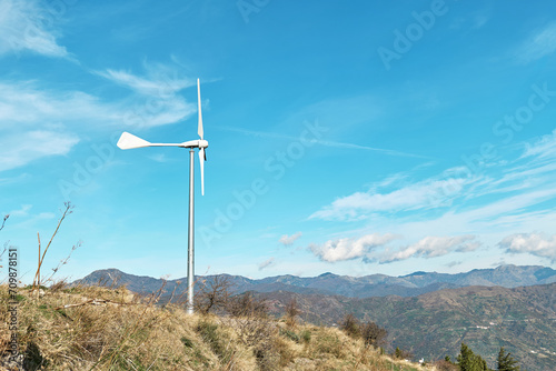 Green energy concept. Мountain top industrial wind power plant, wind turbine for generation electricity in wind farm or wind park.