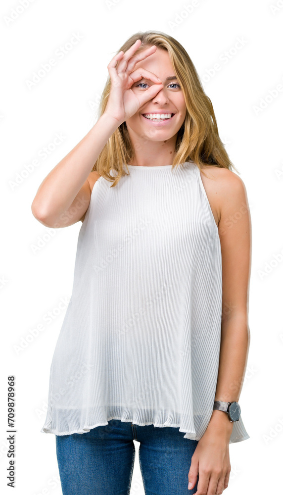 Beautiful young elegant woman over isolated background doing ok gesture with hand smiling, eye looking through fingers with happy face. Beautiful young elegant woman over isolated background doing ok gesture with hand smiling, eye looking through fingers with happy face.