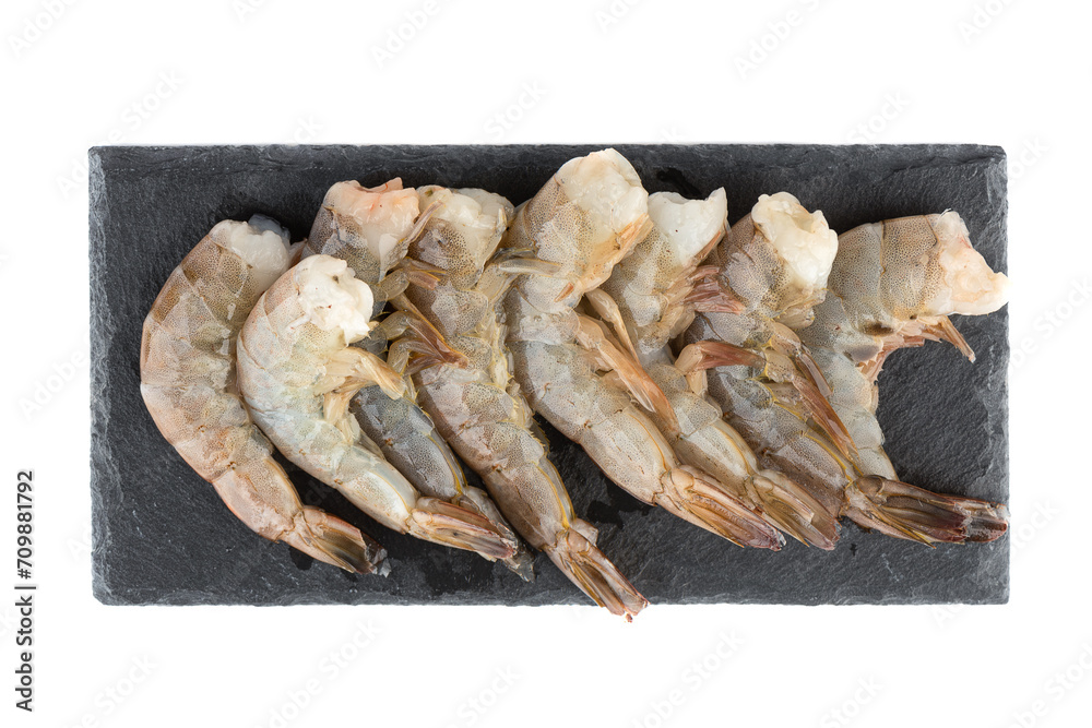 Top view of raw fresh tiger prawns without heads on a mica cutting board. Top view of raw fresh tiger prawns without heads on a mica cutting board.