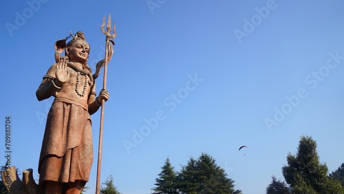 old statue of god shiv holding trishul © FireFXStudio