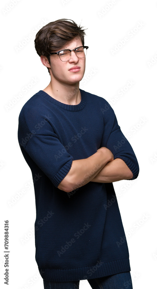Young handsome man wearing glasses over isolated background skeptic and nervous, disapproving expression on face with crossed arms. Negative person. Young handsome man wearing glasses over isolated background skeptic and nervous, disapproving expression on face with crossed arms. Negative person.
