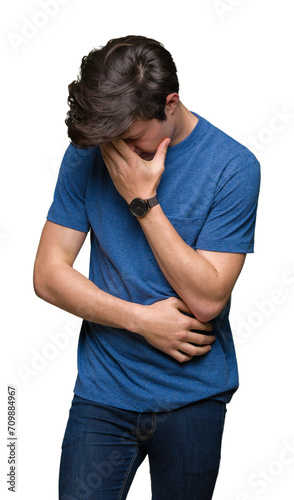 Young handsome man wearing blue t-shirt over isolated background with sad expression covering face with hands while crying. Depression concept.