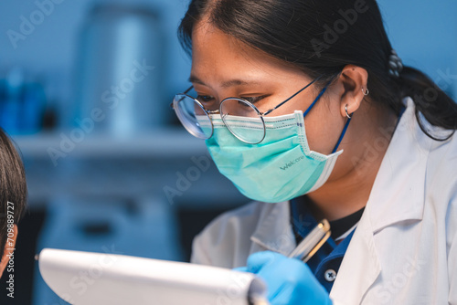 Scientists using microscope...