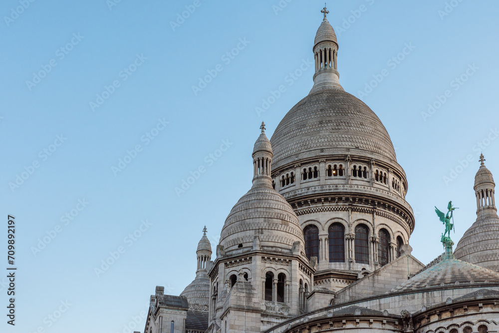 Dome of Basilica of Sacre Coeur de Montmartre, Paris, France at sunset. Roman Catholic church Sacred Heart. Famous landmark. Popular travel destination