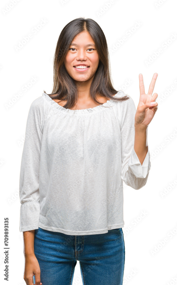 Young asian woman over isolated background showing and pointing up with fingers number two while smiling confident and happy. Young asian woman over isolated background showing and pointing up with fingers number two while smiling confident and happy.