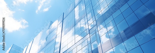 modern office building with glass and clouds