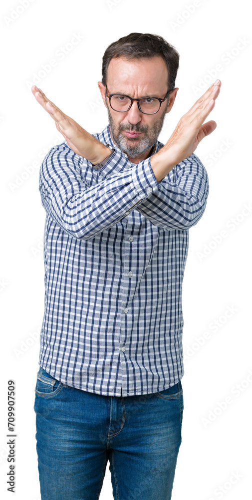 Handsome middle age elegant senior man wearing glasses over isolated background Rejection expression crossing arms doing negative sign, angry face Handsome middle age elegant senior man wearing glasses over isolated background Rejection expression crossing arms doing negative sign, angry face