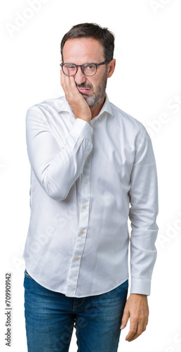 Handsome middle age elegant senior business man wearing glasses over isolated background thinking looking tired and bored with depression problems with crossed arms.