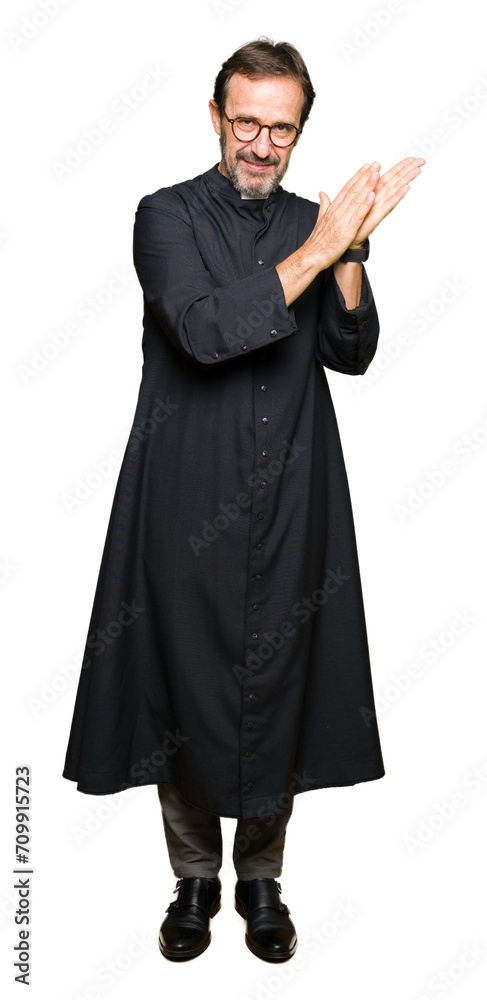 Middle age priest man wearing catholic robe Clapping and applauding happy and joyful, smiling proud hands together Middle age priest man wearing catholic robe Clapping and applauding happy and joyful, smiling proud hands together