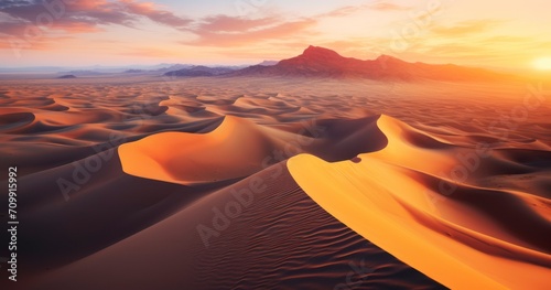 Capturing the Majestic Aerial Landscape of Desert Sands at Dusk