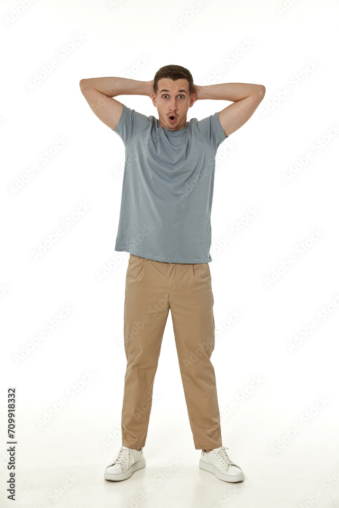 surprised guy looking at camera on white studio background surprised guy looking at camera on white studio background