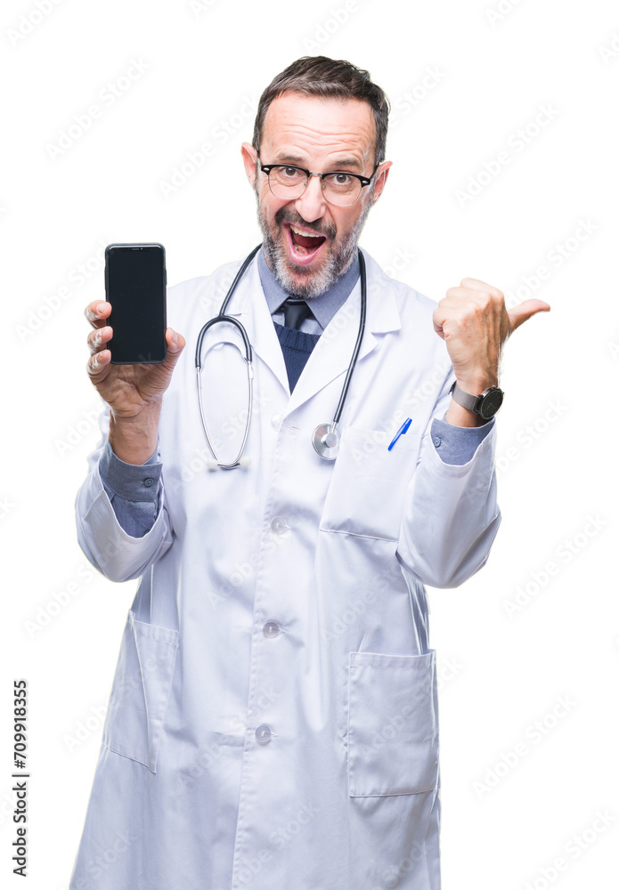 Middle age senior hoary doctor man showing smartphone screen over isolated background pointing and showing with thumb up to the side with happy face smiling Middle age senior hoary doctor man showing smartphone screen over isolated background pointing and showing with thumb up to the side with happy face smiling