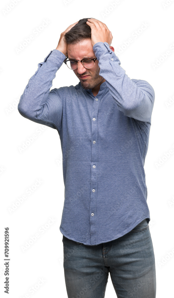 Handsome young elegant man wearing glasses suffering from headache desperate and stressed because pain and migraine. Hands on head. Handsome young elegant man wearing glasses suffering from headache desperate and stressed because pain and migraine. Hands on head.