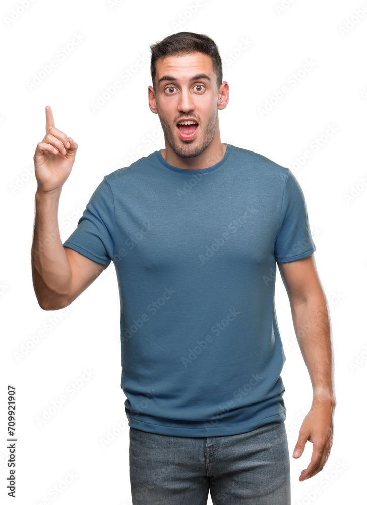 Handsome young casual man pointing finger up with successful idea. Exited and happy. Number one. Handsome young casual man pointing finger up with successful idea. Exited and happy. Number one.