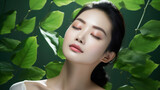 Radiant beauty, Asian woman with a stunning facial glow against background of lush green leaves.