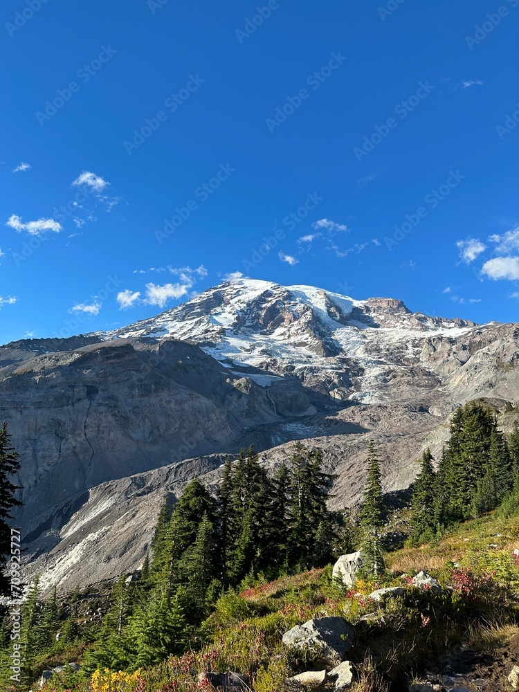 Scenic view of Mount Rainier against the backdrop of a blue sky. Washington state, USA