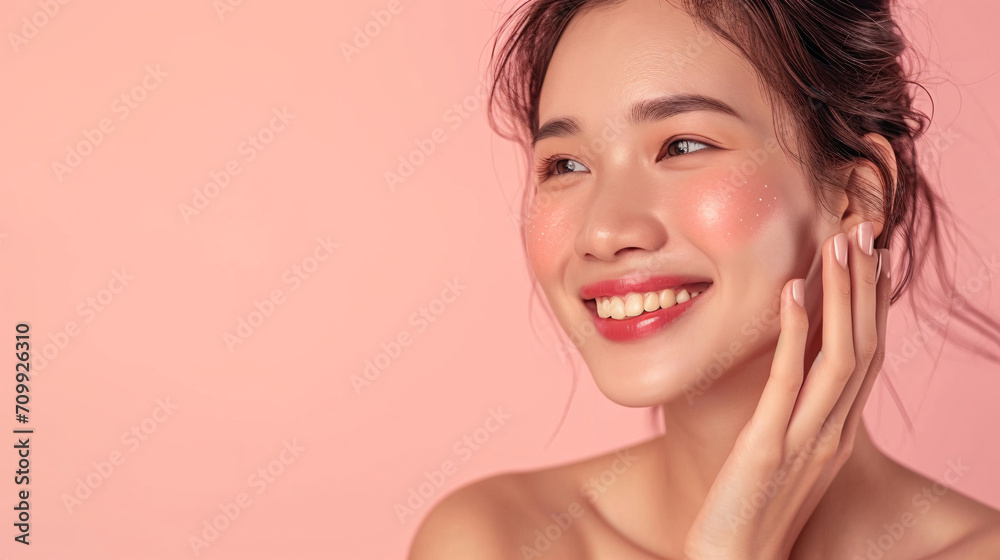 Fototapeta premium Beauty skin. Head and shoulders of asian woman model, touching glowing, hydrated facial skin, apply toner, skin cream or lotion for healthy look, after shower portrait, white background.