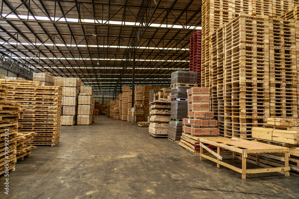 background of pallet wood in warehouse. pattern wood section. Grid of wood squares. the raw of material timber on stack.