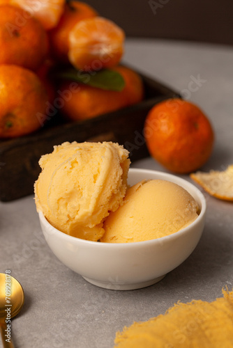 Balls of natural tangerine ice cream