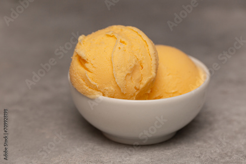 Obraz na plátně Balls of natural tangerine ice cream