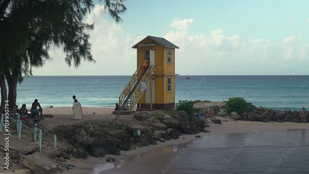 Establishing shot of Miami Beach, aka Enterprise Beach, in Barbados. The footage beautifully captures the serene Caribbean sea, sun-kissed sand, and the vibrant, atmosphere of this tropical paradise Establishing shot of Miami Beach, aka Enterprise Beach, in Barbados. The footage beautifully captures the serene Caribbean sea, sun-kissed sand, and the vibrant, atmosphere of this tropical paradise